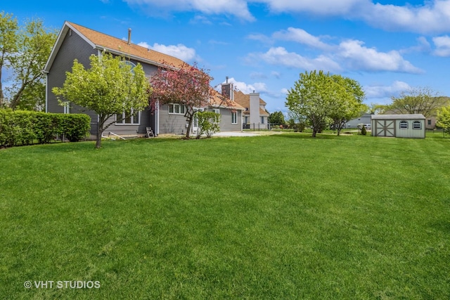 1188 Parkview Ct, Carol Stream, IL 60188 - view of yard with an outdoor structure, a patio, and a storage unit