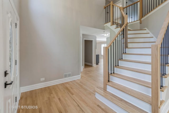 1188 Parkview Ct, Carol Stream, IL 60188 - staircase with baseboards, visible vents, and wood finished floors