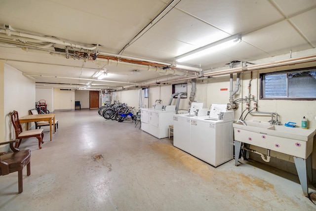 5328 W Windsor Ave Unit 1H, Chicago, IL 60630 - unfinished below grade area with washing machine and dryer and a sink