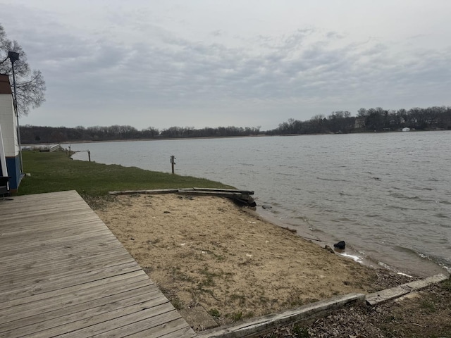 dock area featuring a yard and a water view