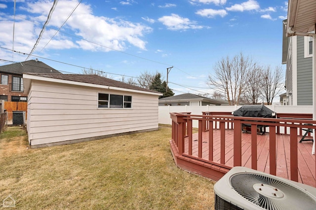 view of yard featuring a deck, a fenced backyard, and central air condition unit