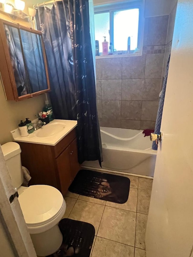 full bathroom with tile patterned flooring, toilet, shower / tub combo, and vanity