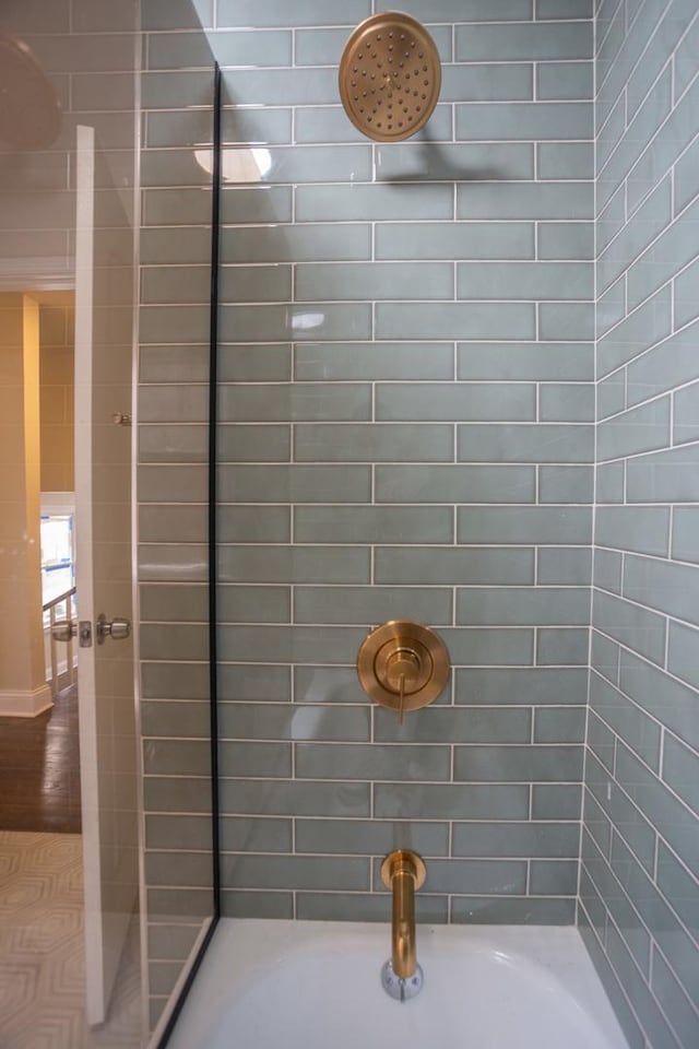 full bath featuring tiled shower