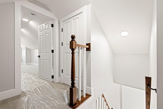 hallway featuring vaulted ceiling