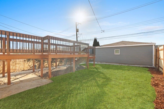 view of yard with fence and a deck