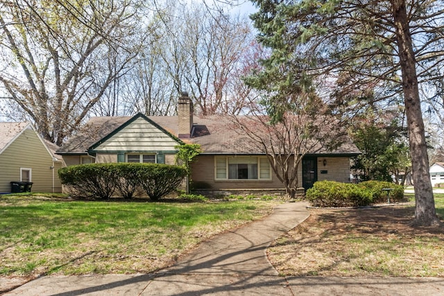 single story home with a front lawn and a chimney