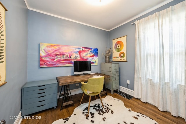 office with baseboards, ornamental molding, and wood finished floors