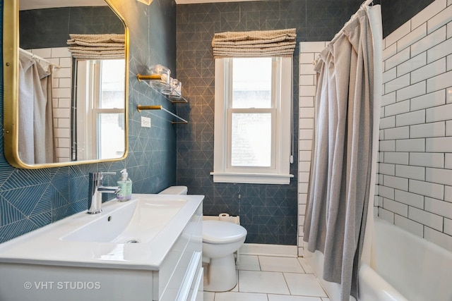 bathroom with vanity, tile patterned flooring, shower / bath combo, and toilet
