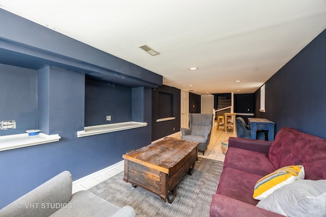 living area featuring visible vents, recessed lighting, and tile patterned floors
