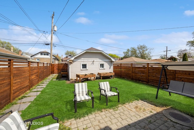 view of yard with a fenced backyard