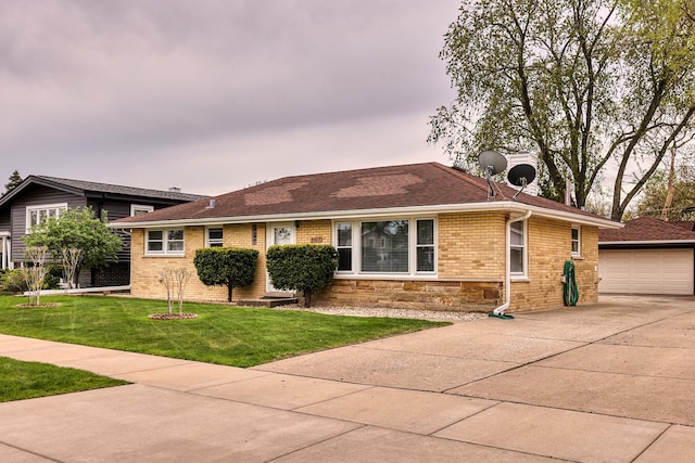 view of front of house featuring stone siding, a garage, brick siding, a front yard, and an outdoor structure