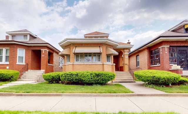 view of front of home featuring brick siding
