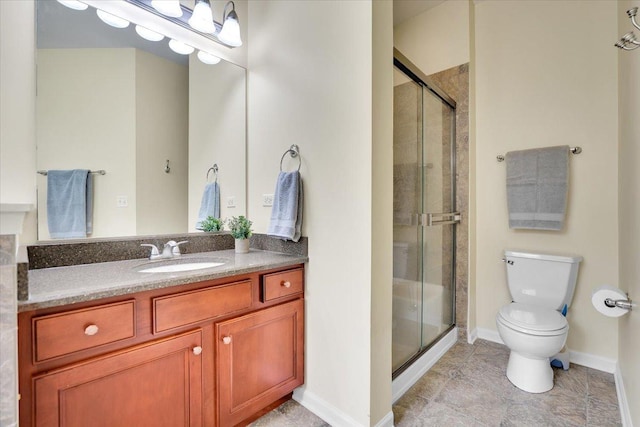 full bath with tile patterned flooring, a shower stall, vanity, baseboards, and toilet