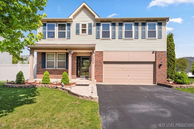 14329 Springfield Ct, Plainfield, IL 60544 - view of front of house featuring an attached garage, asphalt driveway, and brick siding