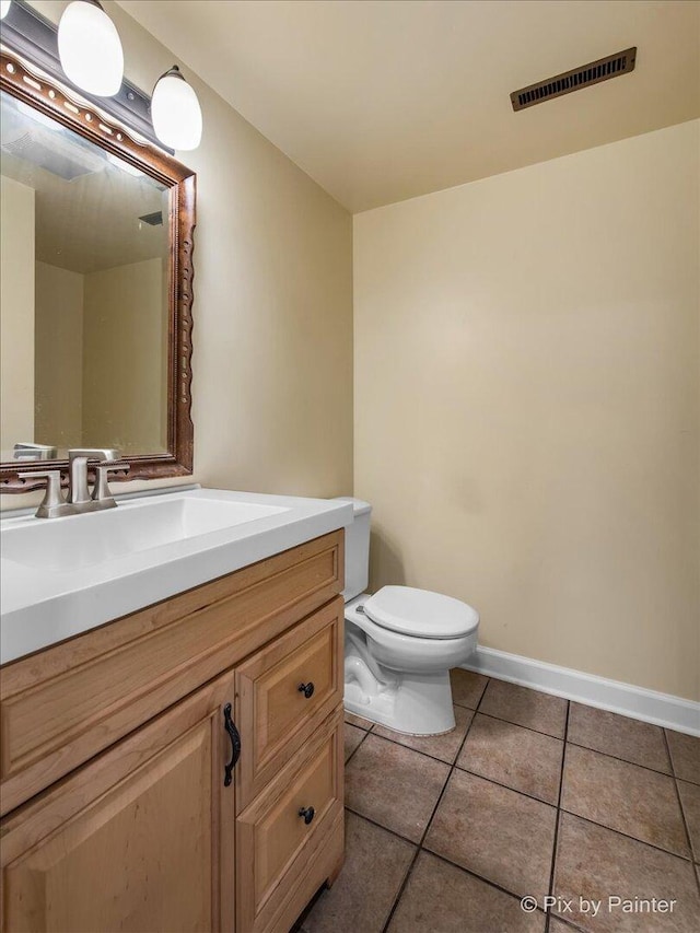 5214 Abbey Dr, Mchenry, IL 60050 - bathroom featuring vanity, toilet, tile patterned floors, and baseboards