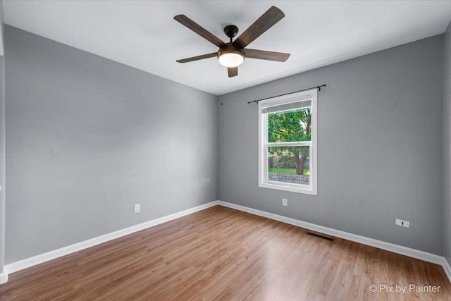 5214 Abbey Dr, Mchenry, IL 60050 - spare room with wood finished floors, a ceiling fan, and baseboards