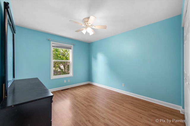 5214 Abbey Dr, Mchenry, IL 60050 - unfurnished room featuring ceiling fan, wood finished floors, and baseboards