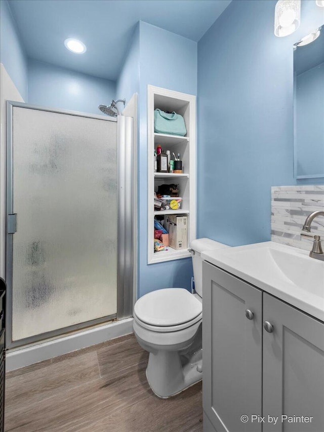 5214 Abbey Dr, Mchenry, IL 60050 - bathroom featuring wood finished floors, vanity, a stall shower, and toilet