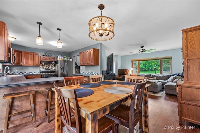 5214 Abbey Dr, Mchenry, IL 60050 - dining area featuring ceiling fan, wood finished floors, and a chandelier