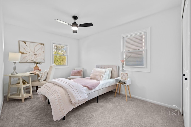 bedroom featuring ceiling fan, carpet, and baseboards