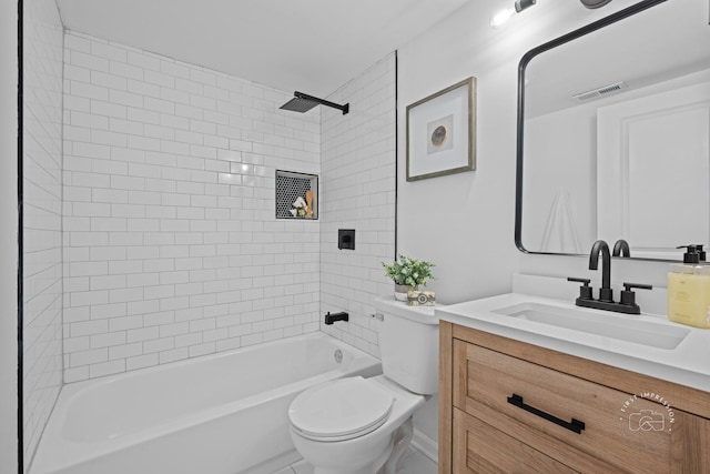 bathroom featuring toilet, visible vents, vanity, and shower / bathing tub combination