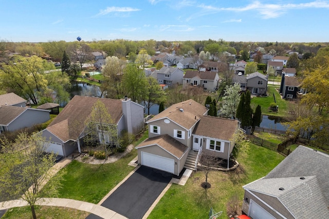 aerial view featuring a water view and a residential view