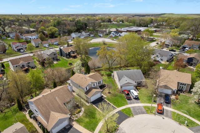 birds eye view of property with a residential view and a water view