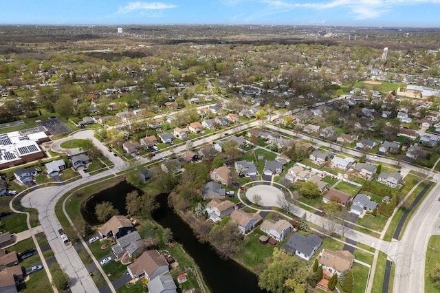 aerial view with a residential view and a water view