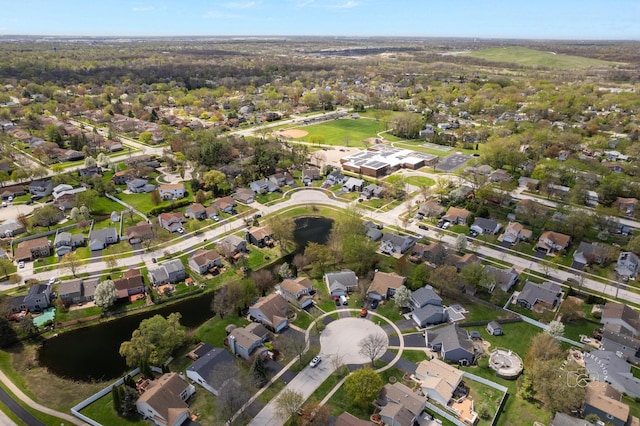 birds eye view of property featuring a residential view and a water view