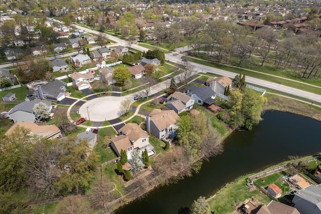 birds eye view of property featuring a residential view and a water view