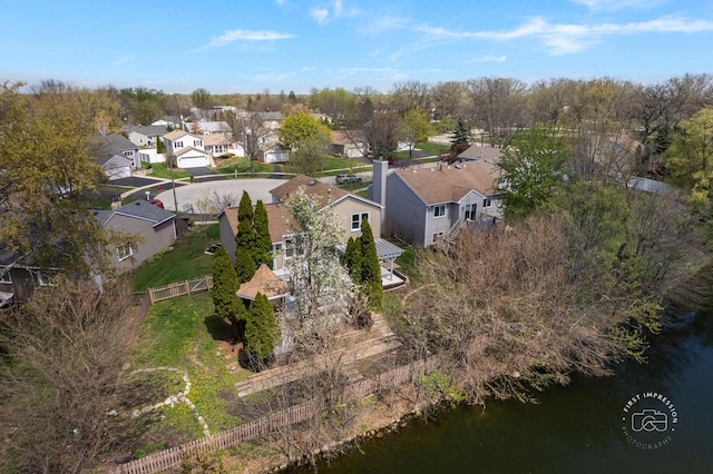 bird's eye view with a water view and a residential view