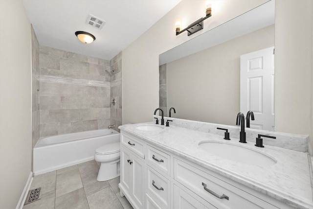 511 Freeman Ave, Streamwood, IL 60107 - full bath with double vanity, toilet, visible vents, and a sink