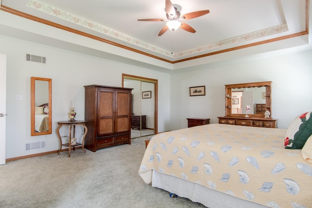 carpeted bedroom featuring baseboards, visible vents, a ceiling fan, and a closet
