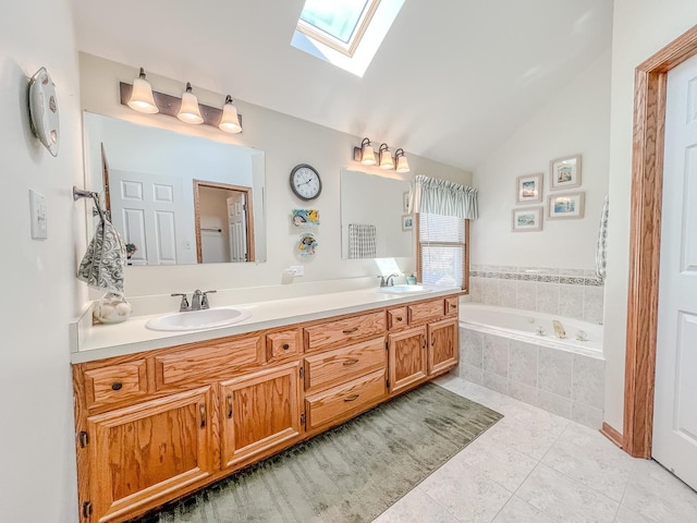 full bathroom featuring tile patterned floors, a garden tub, double vanity, and a sink