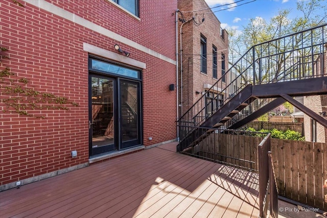 deck featuring fence and stairway