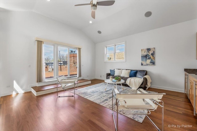 living area with a ceiling fan, baseboards, recessed lighting, lofted ceiling, and dark wood-type flooring