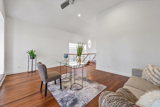 office with baseboards, ceiling fan, dark wood finished floors, and high vaulted ceiling