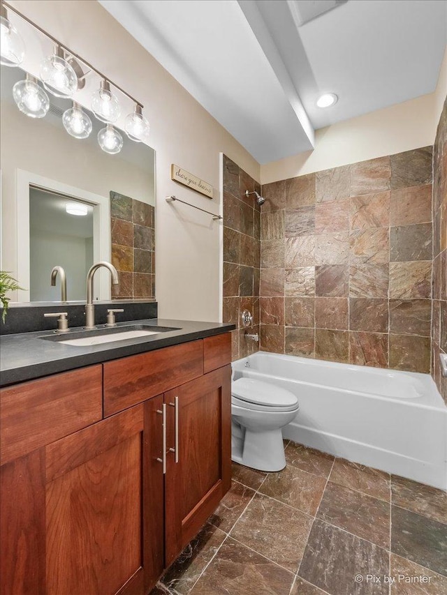 full bathroom with toilet, washtub / shower combination, and vanity