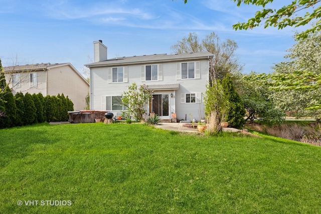 14252 S Hemingway Cir, Plainfield, IL 60544 - rear view of property with a lawn, a patio, a chimney, and a hot tub