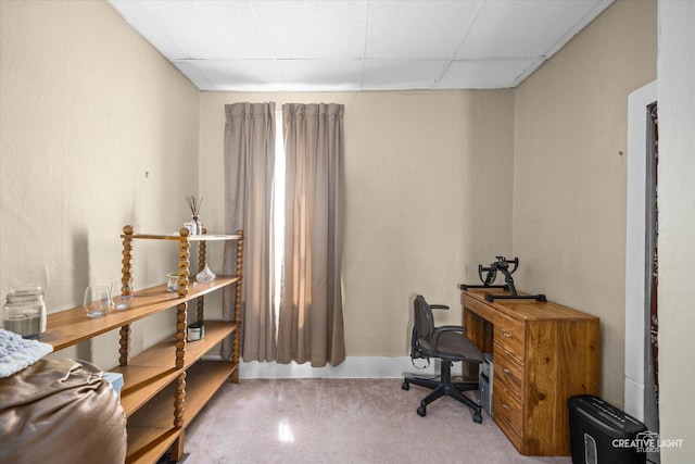office area with a paneled ceiling and baseboards