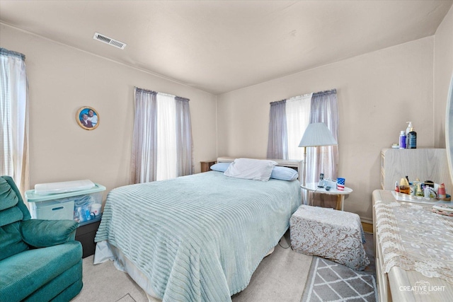 bedroom with light carpet