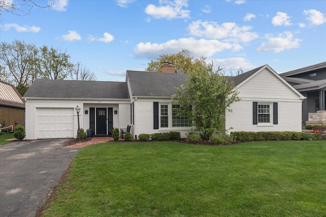 273 Eaton St, Northfield, IL 60093 - ranch-style home with an attached garage, a chimney, a front yard, brick siding, and driveway