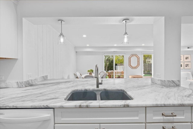 273 Eaton St, Northfield, IL 60093 - kitchen featuring light stone countertops, white cabinets, and a sink