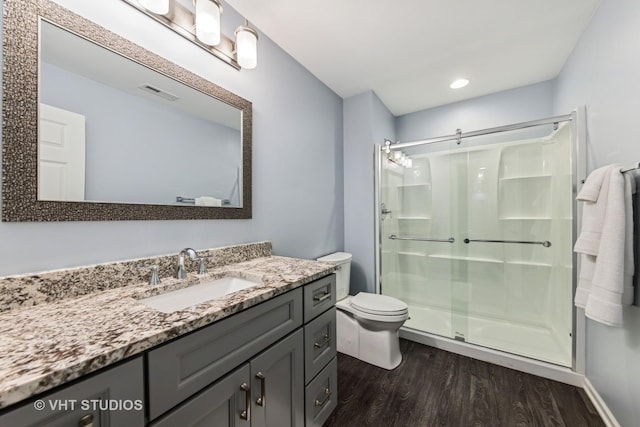 1178 Drury Ln, Aurora, IL 60502 - full bathroom featuring wood finished floors, a stall shower, toilet, vanity, and recessed lighting
