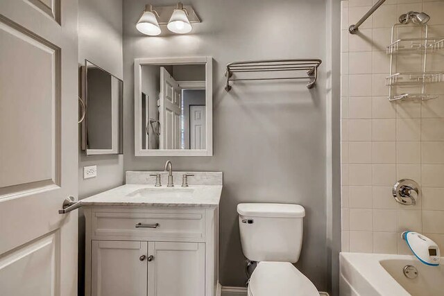 full bath featuring toilet, tub / shower combination, and vanity