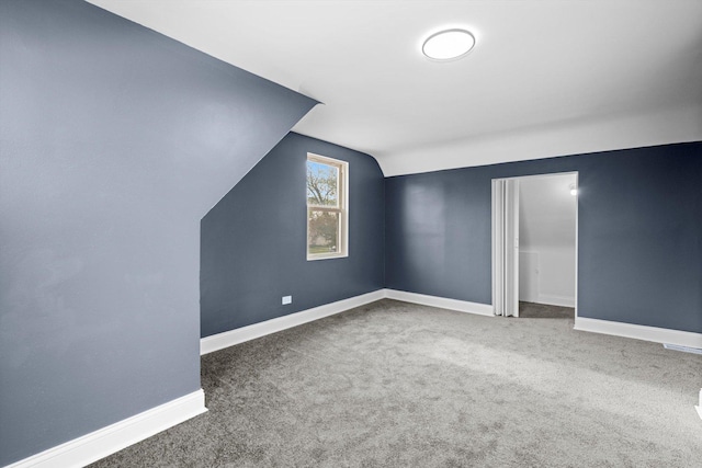 bonus room with baseboards, carpet floors, and lofted ceiling
