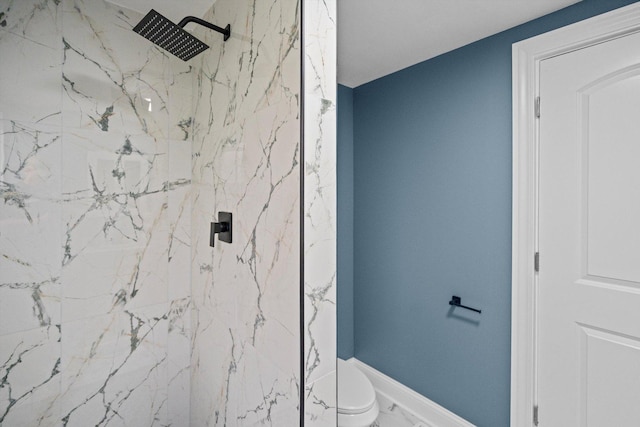 bathroom featuring toilet, a marble finish shower, and marble finish floor