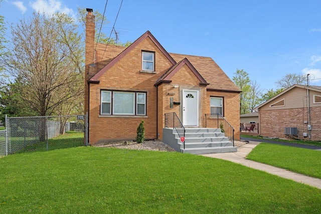 bungalow featuring fence, a front yard, a chimney, brick siding, and central AC unit
