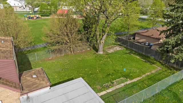 view of yard with a playground and fence