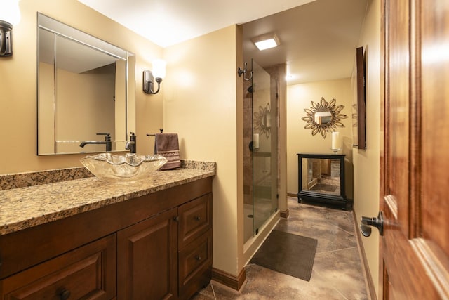 bathroom featuring a stall shower and vanity